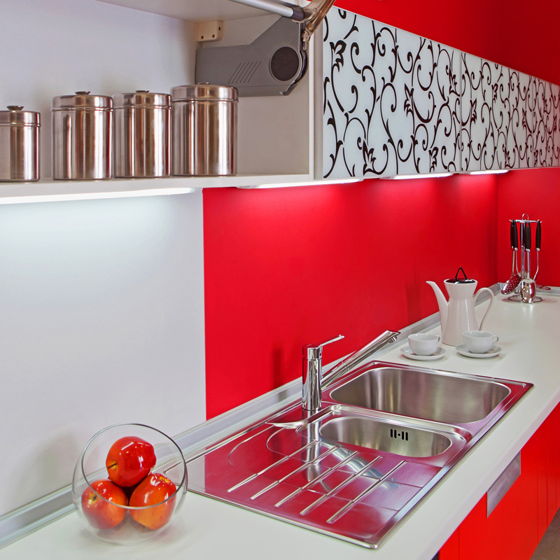 Luxurious new red kitchen with modern appliances with red decoration
